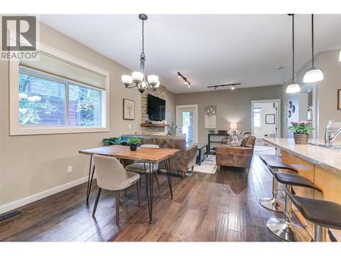 Dining to living room with electric fireplace at 511 Yates Road Unit# 110, North Glenmore, Kelowna