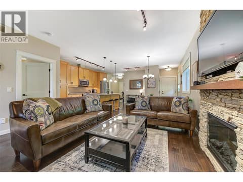 Living room with electric fireplace at 511 Yates Road Unit# 110, North Glenmore, Kelowna