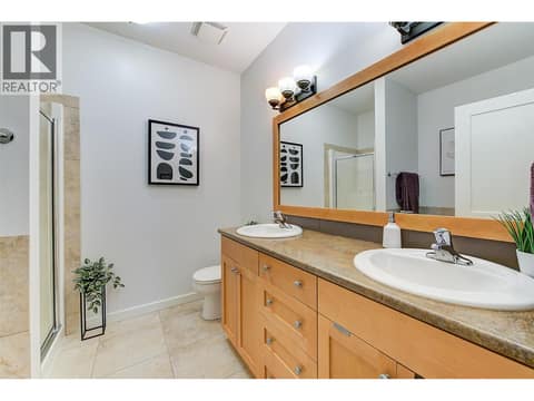 Primary ensuite with dual vanities, soaker tub and shower at 511 Yates Road Unit# 110, North Glenmore, Kelowna