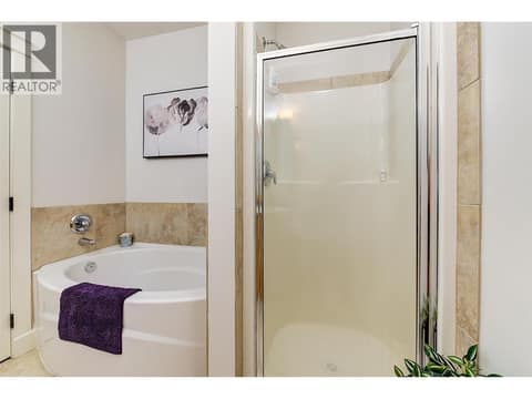 Primary ensuite with dual vanities, soaker tub and shower at 511 Yates Road Unit# 110, North Glenmore, Kelowna