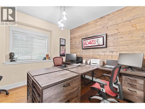 Main floor bedroom 2, currently set up as an office at 5100 Haynes Road, North BX, Vernon