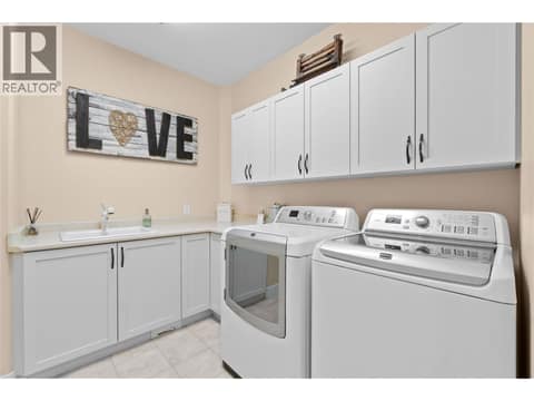 Main floor large laundry room at 5100 Haynes Road, North BX, Vernon