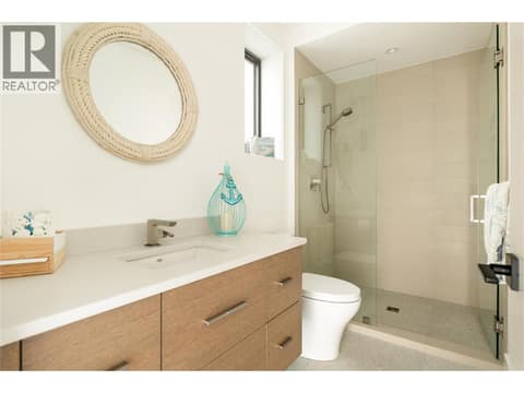 Lower Full Bath leading to pool at 538 Clifton Court, Glenmore, Kelowna