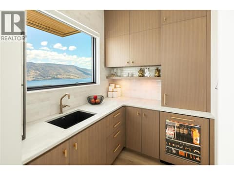 Pantry with sink and Jenn-Air beverage fridge at 538 Clifton Court, Glenmore, Kelowna