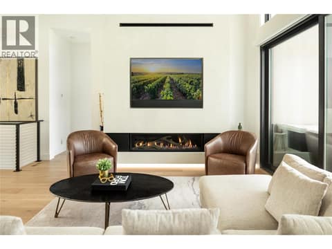 Recessed 65"" TV with custom width speaker bar at 538 Clifton Court, Glenmore, Kelowna