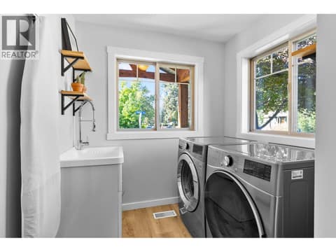 Main floor laundry room at 905 Paret Crescent, Lower Mission, Kelowna