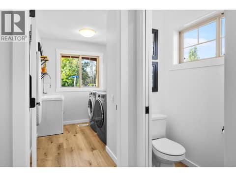 Main floor powder room and laundry room at 905 Paret Crescent, Lower Mission, Kelowna