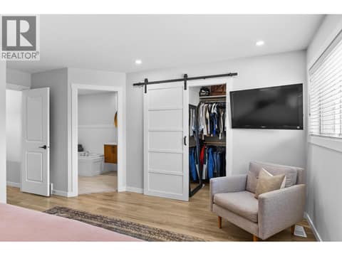 Primary bedroom upstairs with walk-in closet at 905 Paret Crescent, Lower Mission, Kelowna