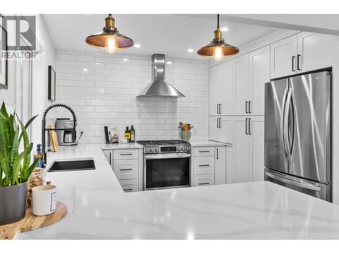 Updated kitchen with quartz counters at 905 Paret Crescent, Lower Mission, Kelowna