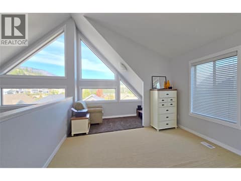 Open plan loft bedroom at 6822 Madrid Way Unit# 310, Fintry, Kelowna