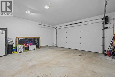 Attached Double with New EV Level 2 charger at 7151 Dunwaters Road, Fintry, Kelowna