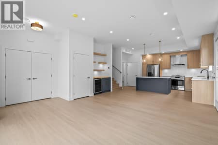 Spacious great room. Photo of opposite side unit at 662 Birch Avenue Unit# 1, Kelowna South