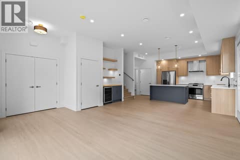 Spacious great room. Photo of opposite side unit at 662 Birch Avenue Unit# 1, Kelowna South