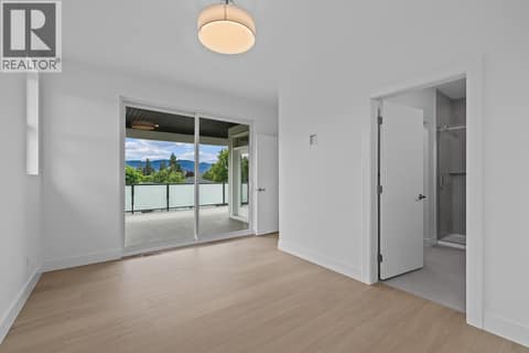 Top floor primary suite to deck. Photo of opposite side unit at 662 Birch Avenue Unit# 1, Kelowna South
