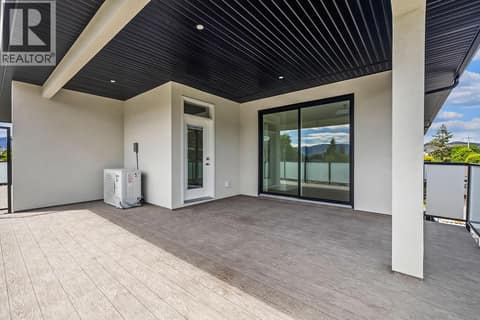 Upper deck off primary bedroom. Photo of opposite side unit at 662 Birch Avenue Unit# 1, Kelowna South