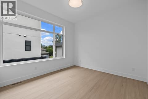 2nd floor bedroom. Photo of opposite side unit at 662 Birch Avenue Unit# 4, Kelowna South
