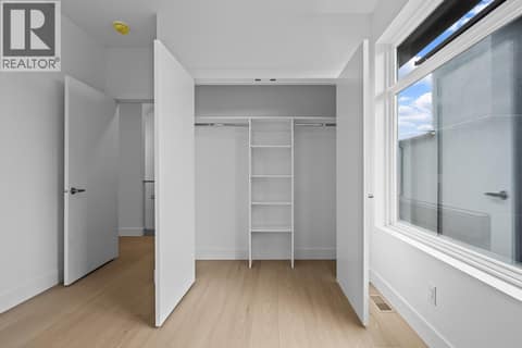 2nd floor bedroom. Photo of opposite side unit at 662 Birch Avenue Unit# 4, Kelowna South