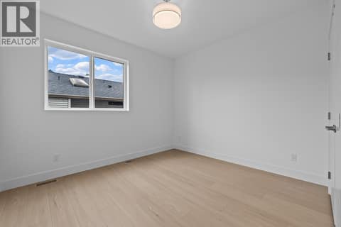 2nd floor bedroom. Photo of opposite side unit at 662 Birch Avenue Unit# 4, Kelowna South