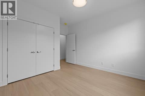 2nd floor bedroom. Photo of opposite side unit at 662 Birch Avenue Unit# 4, Kelowna South