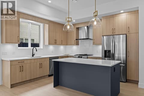 Fabulous kitchen finishing. Photo of opposite side unit at 662 Birch Avenue Unit# 4, Kelowna South