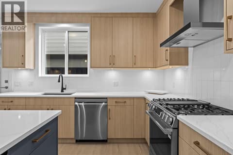 Fabulous kitchen finishing. Photo of opposite side unit at 662 Birch Avenue Unit# 4, Kelowna South
