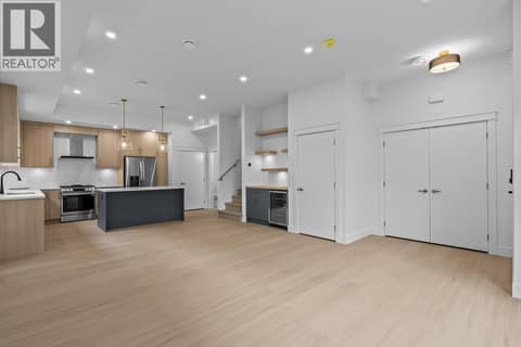 Huge great room. Photo of opposite side unit at 662 Birch Avenue Unit# 4, Kelowna South