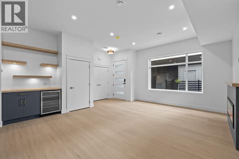 Huge great room. Photo of opposite side unit at 662 Birch Avenue Unit# 4, Kelowna South