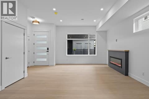 Huge great room. Photo of opposite side unit at 662 Birch Avenue Unit# 4, Kelowna South