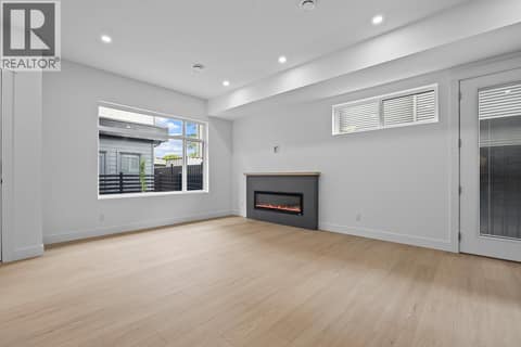 Huge great room. Photo of opposite side unit at 662 Birch Avenue Unit# 4, Kelowna South