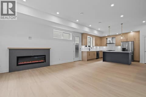 Linear fireplace. Photo of opposite side unit at 662 Birch Avenue Unit# 4, Kelowna South