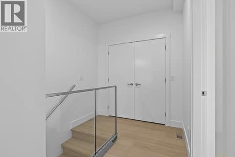 Moving to the second floor bedrooms/bathroom. Photo of opposite side unit at 662 Birch Avenue Unit# 4, Kelowna South