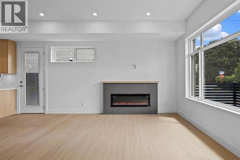 Linear fireplace. at 662 Birch Avenue Unit# 2, Kelowna South