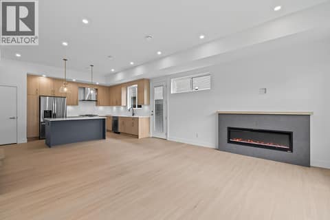 Linear fireplace. at 662 Birch Avenue Unit# 2, Kelowna South