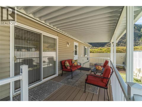 Covered deck and sliding doors to living room at 7545 Dallas Drive Unit# 54, Dallas, Kamloops