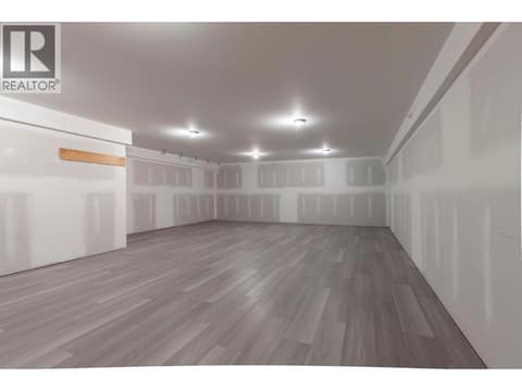 Ready for paint! Rec Room with new flooring at 1740 Granite Road, Lake Country South West