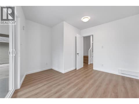 Main floor bedroom at 10824 Westshore Road, Okanagan North, Vernon