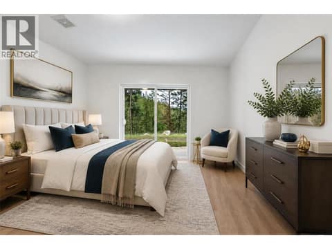 Main floor bedroom virtually staged at 10824 Westshore Road, Okanagan North, Vernon