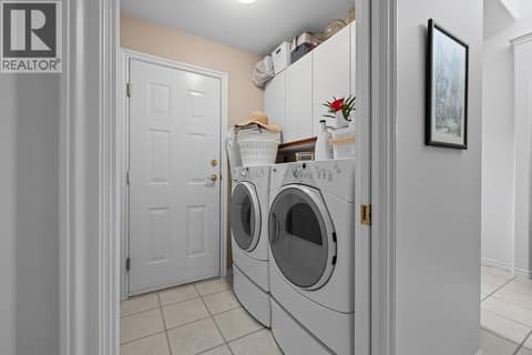 Laundry Room with Access to Garage at 3889 Gallaghers Grange, South East Kelowna