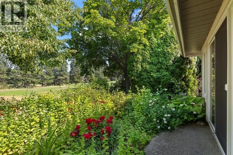Patio Surrounded by Mature Landscaping at 3889 Gallaghers Grange, South East Kelowna