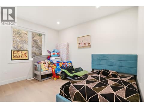Third bedroom on upstairs main level at 647 Deans Drive, Black Mountain, Kelowna