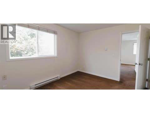 Front Bedroom, no closet, park view at 625 Rowcliffe Avenue Unit# 207, Kelowna South