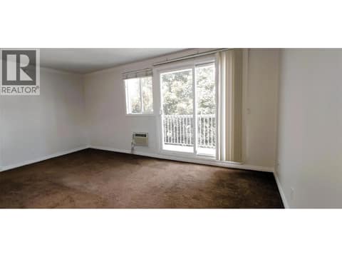 Living room  with patio slider at 625 Rowcliffe Avenue Unit# 207, Kelowna South