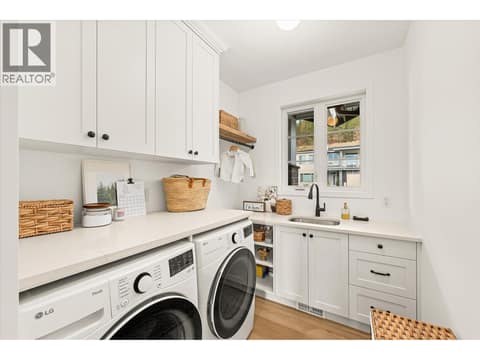 Main floor laundry at 2815 Copper Ridge Drive, Smith Creek, West Kelowna