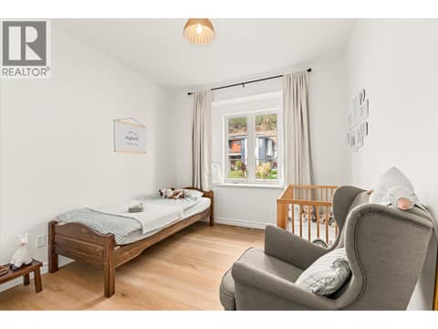 The main floor’s second bedroom at 2815 Copper Ridge Drive, Smith Creek, West Kelowna