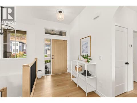 You are welcomed into a spacious and bright entryway at 2815 Copper Ridge Drive, Smith Creek, West Kelowna