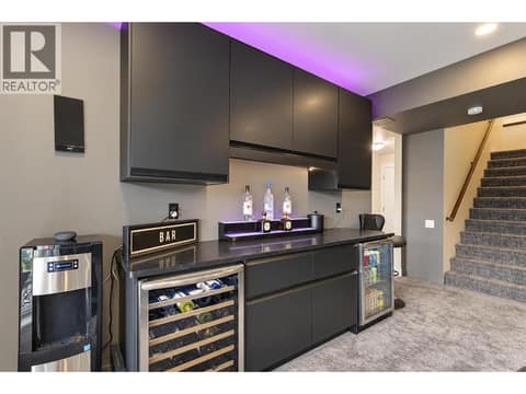 Custom built in dry bar with a wine fridge and a beverage fridge. at 2151 Madera Court, Westbank Centre, West Kelowna