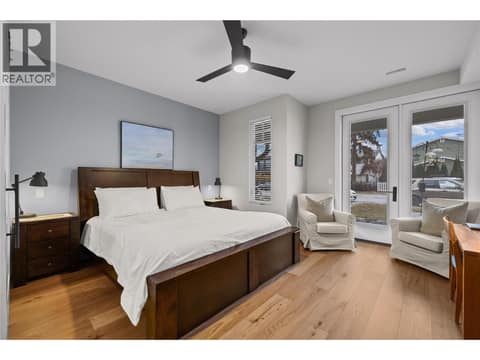 Main floor primary bedroom at 2050 Long Street, Kelowna South