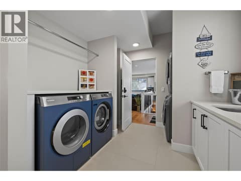 Second floor laundry with second access to owners living quarters/suite at 2050 Long Street, Kelowna South