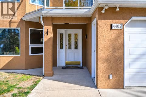 Virtually removed plant pots and table and chairs from front porch at 4405 Ottley Road, Lake Country South West
