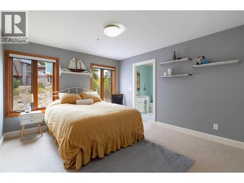 Lower bedroom with ensuite at 9845 Eastside Road Unit# 144, Okanagan Landing, Vernon